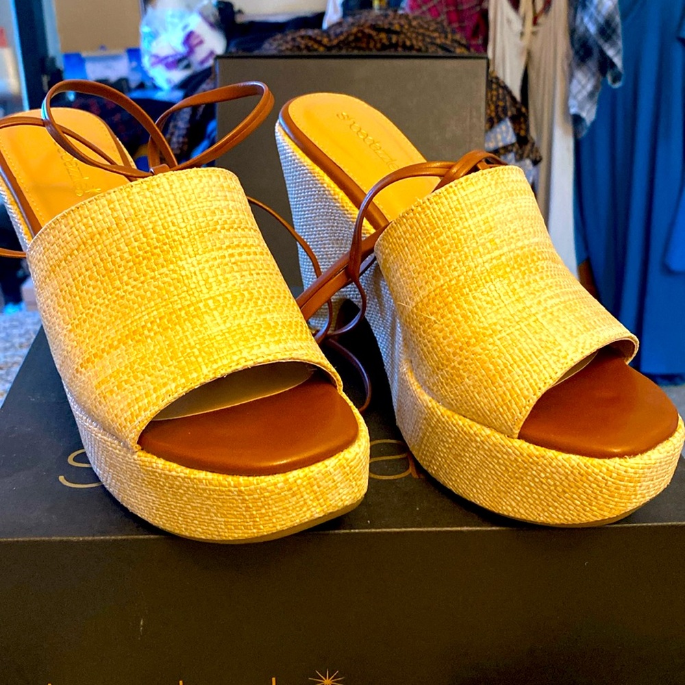 Brown and tan clogs